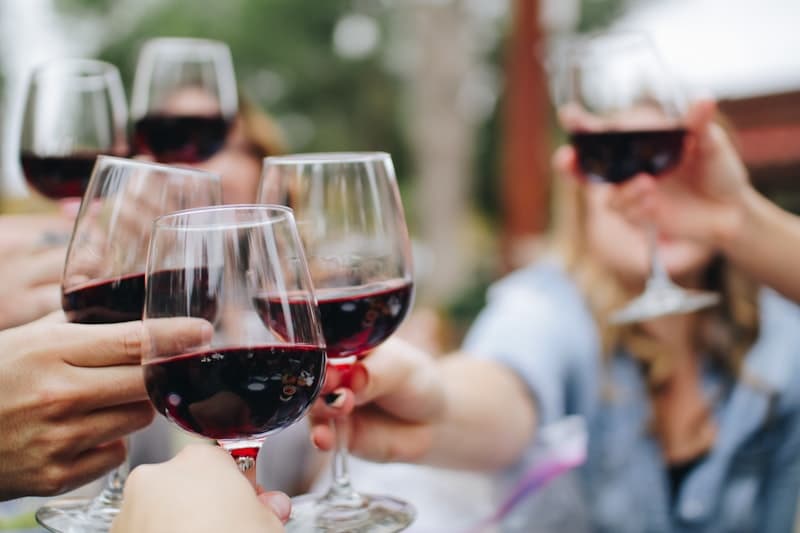 Sommelier pouring wine at a restaurant table